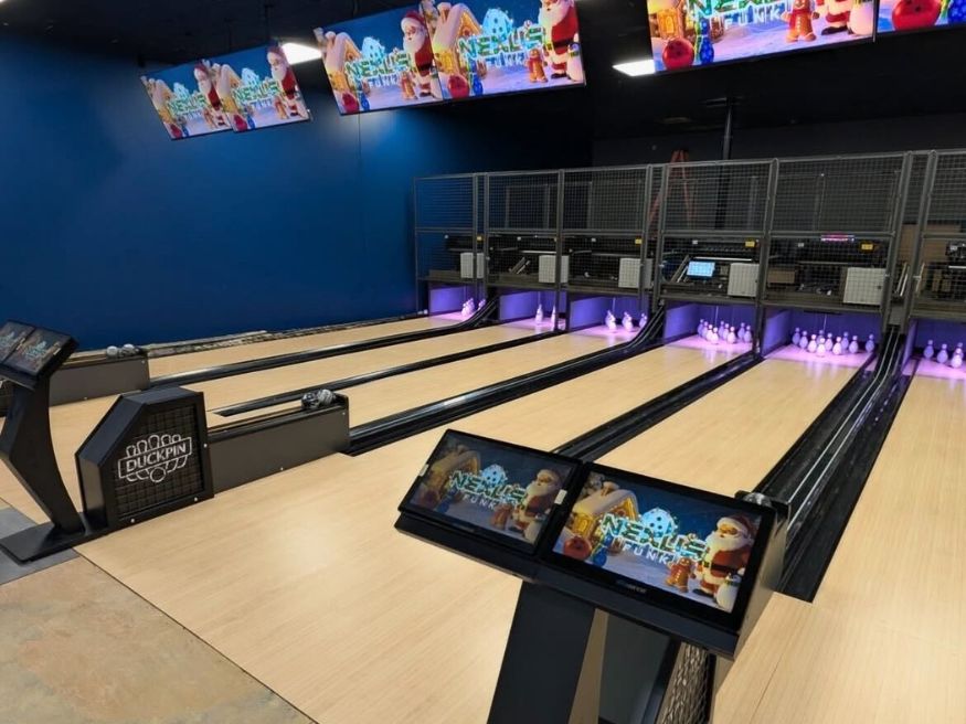 Modern bowling alley construction featuring six duckpin lanes with scoring systems installed at Buffaloe Lanes in Mebane, NC