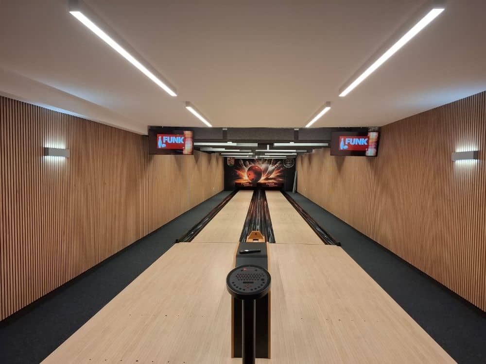 Modern bowling alley equipment with two tenpin lanes installed in renovated community center in Winterrieden, Germany