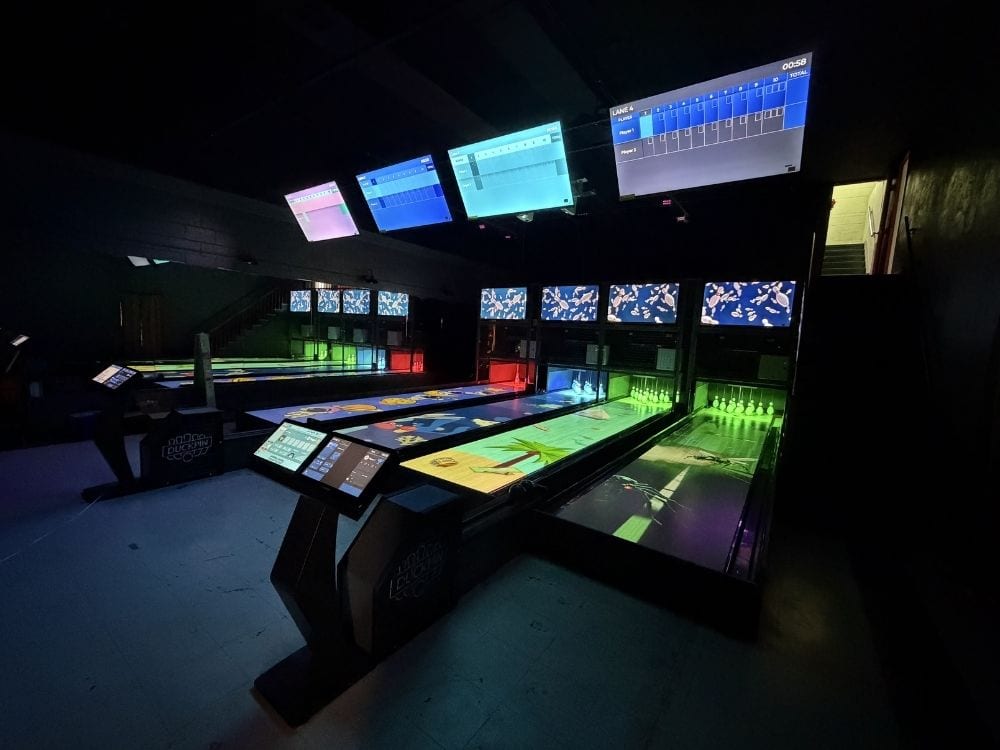 Interactive duckpin bowling alley equipment at The Vault in Jefferson City, TN featuring four bowling lanes, Nexus scoring, and on-lane projection.