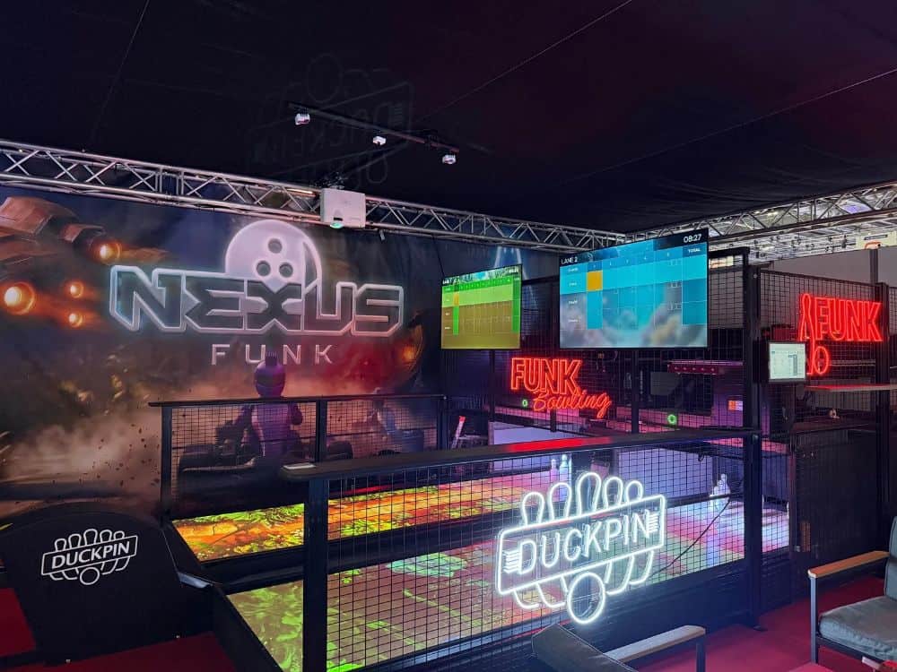 Funk Bowling's duckpin bowling lanes at IAAPA Expo Europe 2026, featuring Nexus scoring, colorful on-lane projection, and illuminated Funk signage.